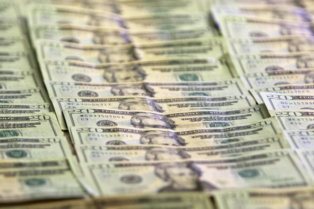 A pile of twenty dollar bills sitting on top of each other