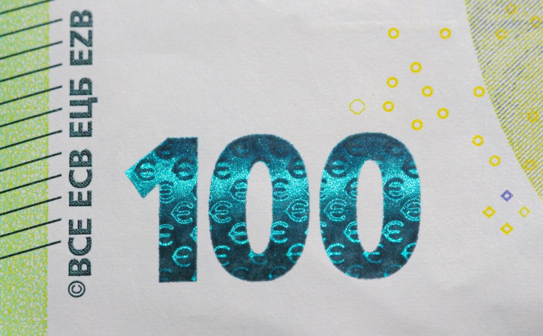 A paper bill with the number ten on it